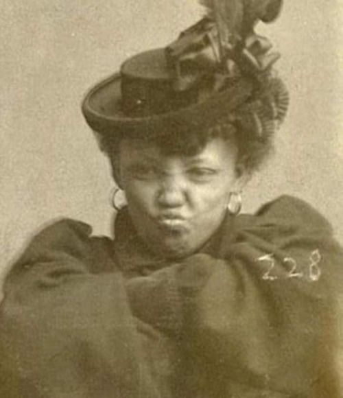 Goldie Williams, AKA Meg Murphy. Arrested For Vagrancy & Refused to Unfold Her Arms and Stop Making This Face For Her 1898 Mugshot. (Omaha, Nebraska).